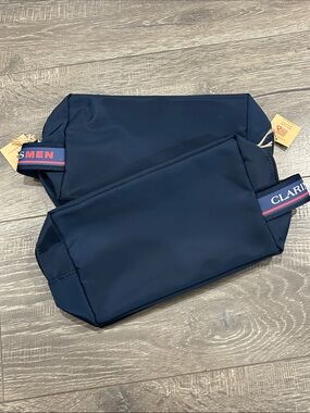 2/$10 Clarins men’s  bags